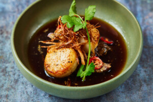 Butter roasted scallops with masterstock braised oxtail, fried shallots and wild garlic leaf photo by David Loftus at The Freak Scene in Parsons Green Butter roasted scallops with masterstock braised oxtail, fried shallots and wild garlic leaf photo by David Loftus at The Freak Scene in Parsons Green